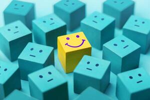 Mind, Mental Health Concept. Varieties of Mood and Emotion. a Unique Smiling Cube that Stand Out among Crowd photo