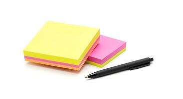 Stack of Colorful Sticky Notes with Black Pen on White Background photo