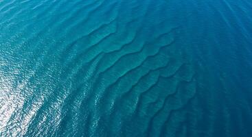 Aerial View of Ocean Water Showing Sandbars and Wave Patterns photo
