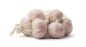 Garlic Bulbs in Net Sack Isolated on White Background Studio Shot photo
