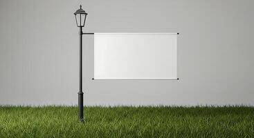 Displaying Blank Banner Hanging on Street Lamp in Green Grass Setting photo
