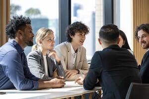 Group of diversity business people are discussing over the new strategic strategy project on investment real estate while working in modern office building for new project and planning concept photo