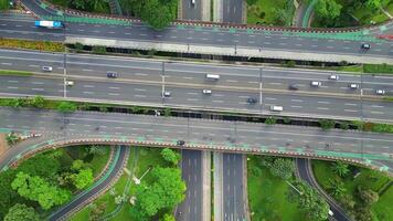 A freeway with a large bridge over it and a city in the background 4 video