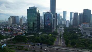 A cityscape with a large highway running through it 2 video