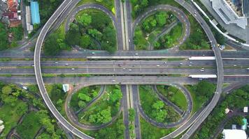 A freeway with a large bridge over it and a city in the background 9 video
