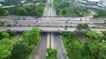 A freeway with a large bridge over it and a city in the background 15 video