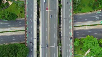 A freeway with a large bridge over it and a city in the background 2 video