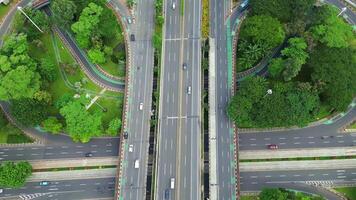 A freeway with a large bridge over it and a city in the background 5 video