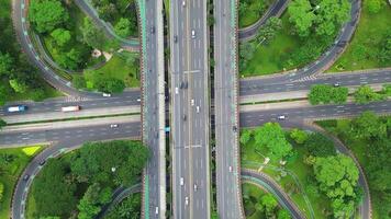A freeway with a large bridge over it and a city in the background 3 video