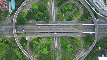 A freeway with a large bridge over it and a city in the background 10 video