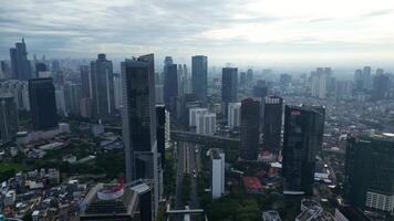 A cityscape with tall buildings and a cloudy sky 2 video