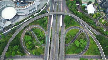 A freeway with a large bridge over it and a city in the background 11 video