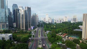 A cityscape with a large highway running through it 1 video