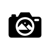 Camera with mountains inside the lens icon vector