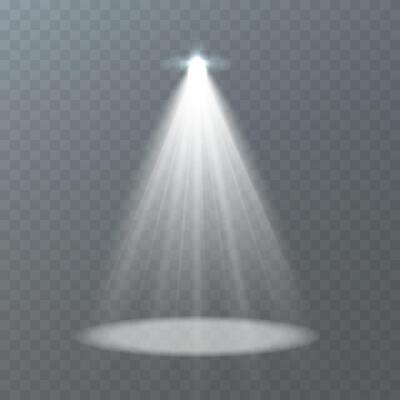 A bright spotlight illuminates a circular area on stage, enhancing the visual effect