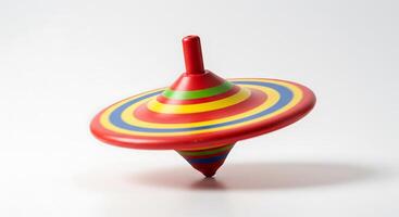 Spinning Colorful Top Toy Motion on White Surface for Children photo