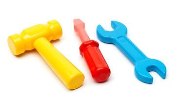 Arrangement of Colorful Plastic Toy Tools Isolated on White Background photo