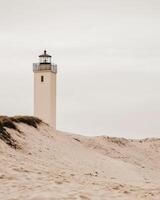 A serene minimalist photograph of a lighthouse on the southern coast. photo