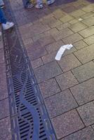 Receipts on Sidewalk in Urban Setting photo