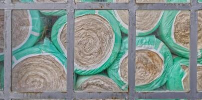 Rolled Insulation Material Behind Metal Grid with windows photo