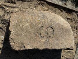 Carved Stone with Stylized Symbol photo