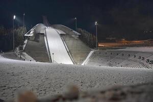 Illuminated Ski Jump Ramp at Night at holmenkollen photo