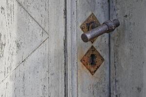 Rustic Wooden Door with Metal Handle photo