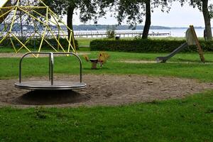 Playground with Merry-Go-Round and Slide photo
