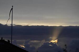 Dramatic Sunset with Rays of Light with danebrog photo