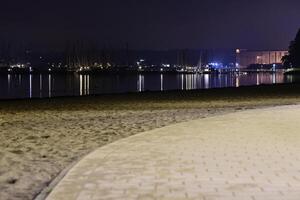Serene Night Beach View with Reflections photo