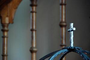 Decorative Metal Cross on Wrought Iron Structure photo