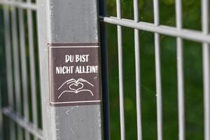 Supportive Message on Fence Sign photo