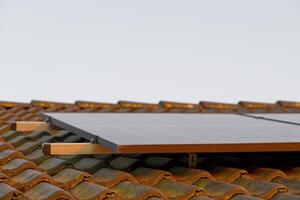 Solar Panels on Rustic Tiled Roof photo