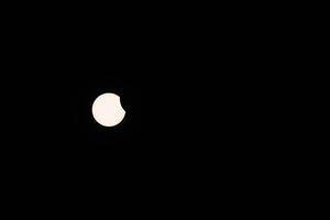 Early Beginning of Partial Solar Eclipse in the Sky from Kollund DK in March 2025 photo