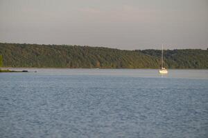 Serene Sailboat on Calm Waters photo
