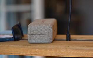 Textured Fabric Case on Wooden Surface photo