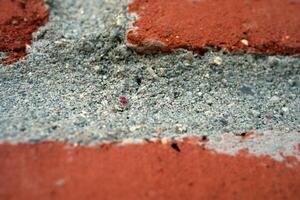 Close-up of Red Brick and Gray Mortar Texture photo