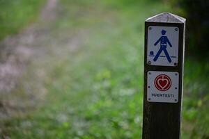 Signpost for Walking Trail with Heart Logo at Gendarmstien photo