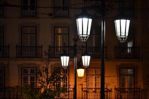 Vintage Street Lamps Illuminating Nighttime Architecture photo