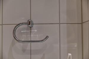 Sleek Chrome Towel Holder on Tiled Wall photo