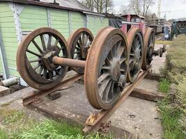 Rusty Vintage Train Wheels on Platform photo