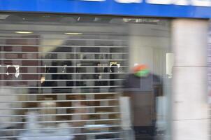 Blurred Storefront with Reflections and Shadows photo