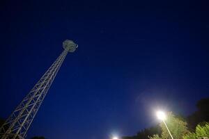 Tall Communication Tower Under Starry Night Sky photo