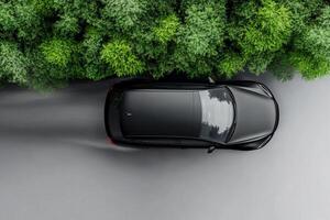 An overhead view of a car driving through a forest photo