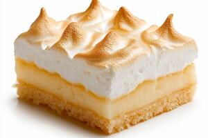 A piece of lemon meringue pie on a white surface photo