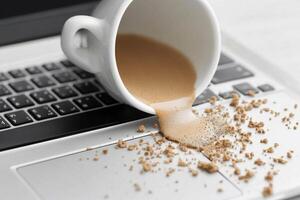 Coffee spill on laptop keyboard photo