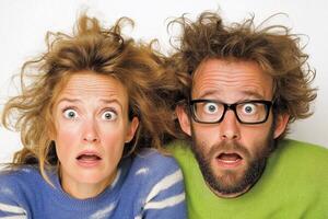 A man and woman with their mouths open photo