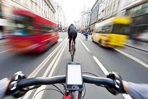 A person riding a bicycle on a busy street photo