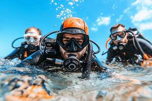 Three scuba divers in the ocean photo