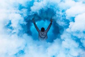 A man standing in a cloud of blue smoke photo